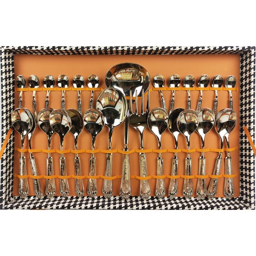 31 - AN ITALIAN NICKEL PLATED CASED CANTEEN OF CUTLERY, comprising twelve dinner forks, twelve knives, tw... 