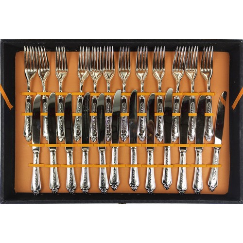 31 - AN ITALIAN NICKEL PLATED CASED CANTEEN OF CUTLERY, comprising twelve dinner forks, twelve knives, tw... 