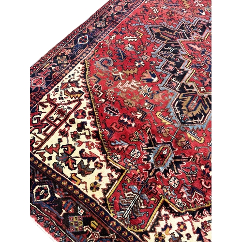 73 - FINE PERSIAN HERIZ CARPET, 345cm x 248cm.