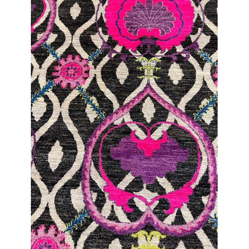 82 - CONTEMPORARY 'FUSCHIA LILYPAD' CARPET, 305cm x 245cm, handwoven wool.