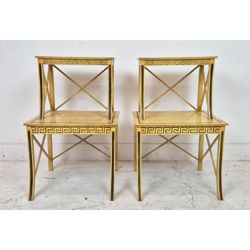 99 - ETAGERES, a pair, yellow and black painted of two tiers, 69cm H x 45cm x 41cm. (2)