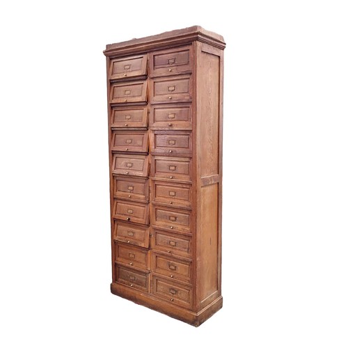 447 - HABERDASHERY CABINET, early 20th century French oak with twenty lift up doors, 213cm H x 95cm W x 38... 