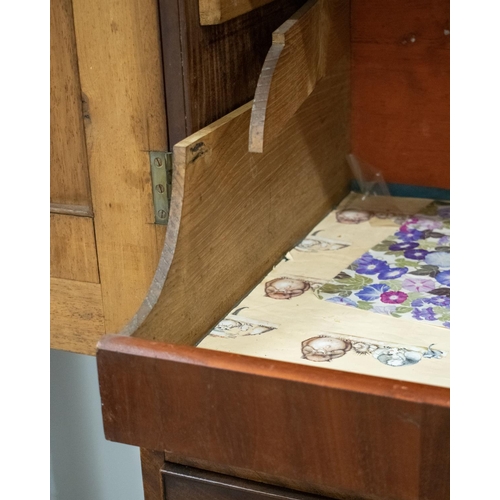 457 - LINEN PRESS, George III mahogany with two doors enclosing sliding trays above a base of three drawer... 