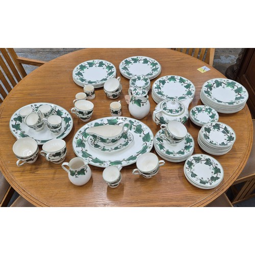 15A - A WEDGEWOOD OF ETRURIA 'NAPOLEON IVY' PATTERN PART DINNER AND TEA SERVICE, including dinner plates, ... 