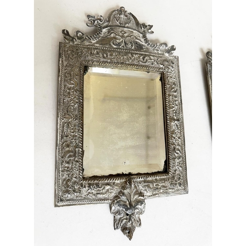 543 - WALL MIRRORS, a pair, early 20th century silvered metal with bevelled plates and lion mask frames, 3... 