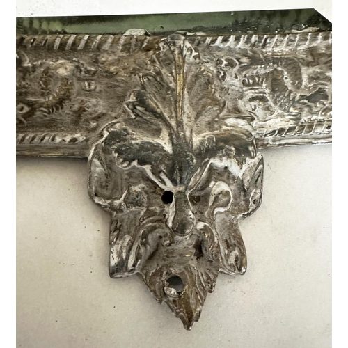 543 - WALL MIRRORS, a pair, early 20th century silvered metal with bevelled plates and lion mask frames, 3... 