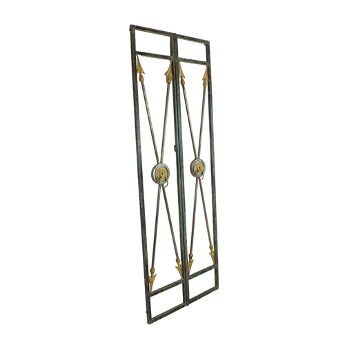 15 - GATES, a pair, 1940s French wrought iron, arrow and lion head design, approx 210cm x 77cm. (2)