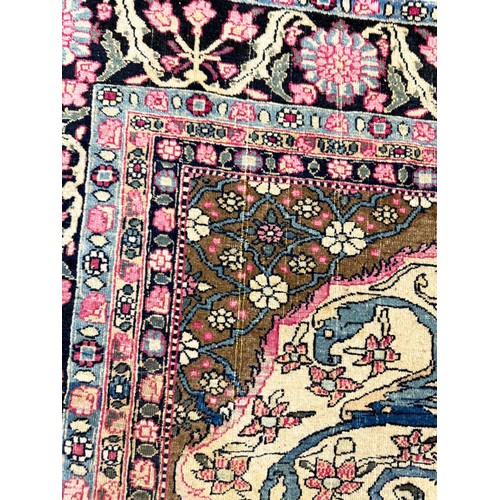 179A - ANTIQUE PERSIAN KERMAN RUG, 205cm x 142cm.