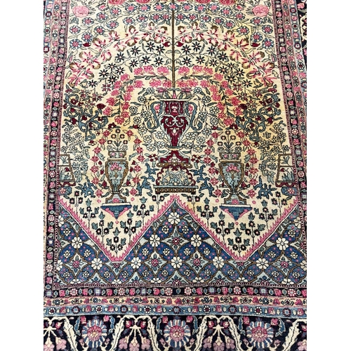 179A - ANTIQUE PERSIAN KERMAN RUG, 205cm x 142cm.