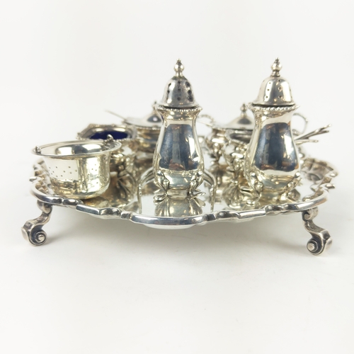 32A - SILVER SALVAR, by Atkins Brothers, Sheffield 1931, 335g approx, together with a silver cruet set, no... 