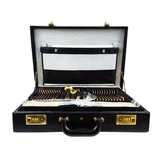 5A - CUTLERY SERVICE, 24ct gold plated, ten place setting with serving pieces, in fitted attache case.