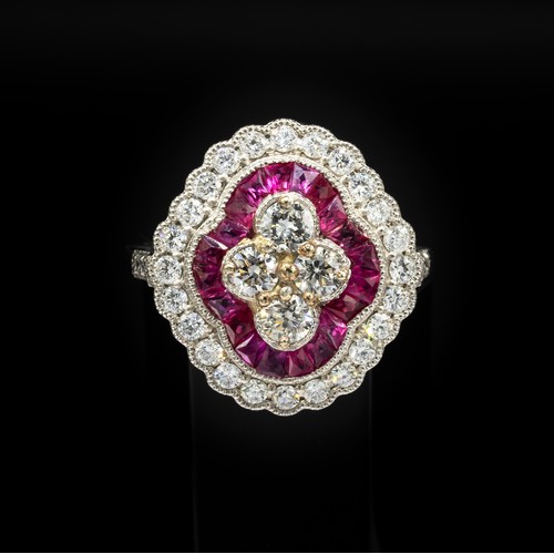 30C - PLATINUM VICTORIAN STYLE RUBY AND DIAMOND QUATREFOIL RING, set with round brilliant cut diamonds and... 