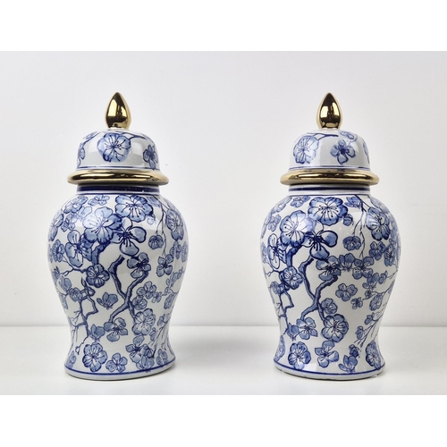 481 - JARS WITH COVERS, a pair, blue and white ceramic, gilt accents, 38cm H approx. (2)