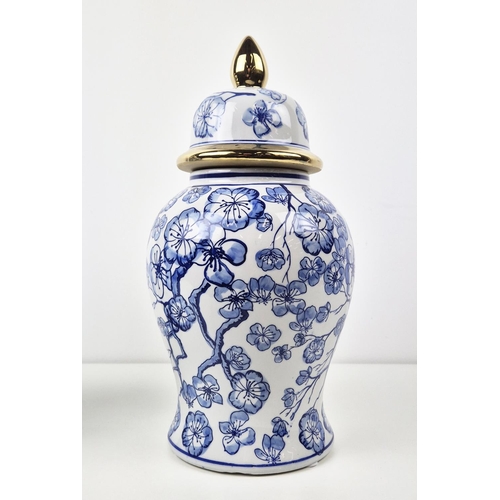 481 - JARS WITH COVERS, a pair, blue and white ceramic, gilt accents, 38cm H approx. (2)