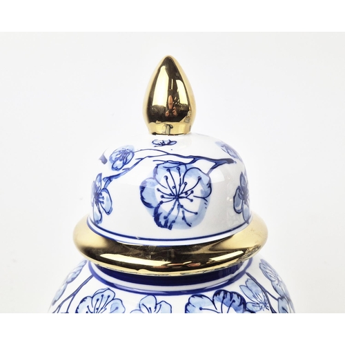 481 - JARS WITH COVERS, a pair, blue and white ceramic, gilt accents, 38cm H approx. (2)