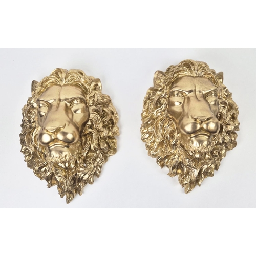 480 - LION HEAD WALL RELIEF PLAQUES, a pair, gilt finished resin, 40cm x 29cm. (2)