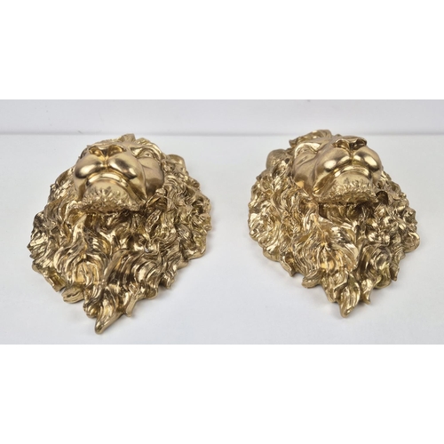 480 - LION HEAD WALL RELIEF PLAQUES, a pair, gilt finished resin, 40cm x 29cm. (2)