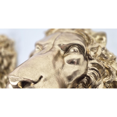 480 - LION HEAD WALL RELIEF PLAQUES, a pair, gilt finished resin, 40cm x 29cm. (2)