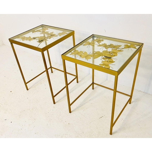 467 - SIDE TABLES, a pair, butterfly design, gilt metal and glass, 58cm H x 40cm W x 40cm D.