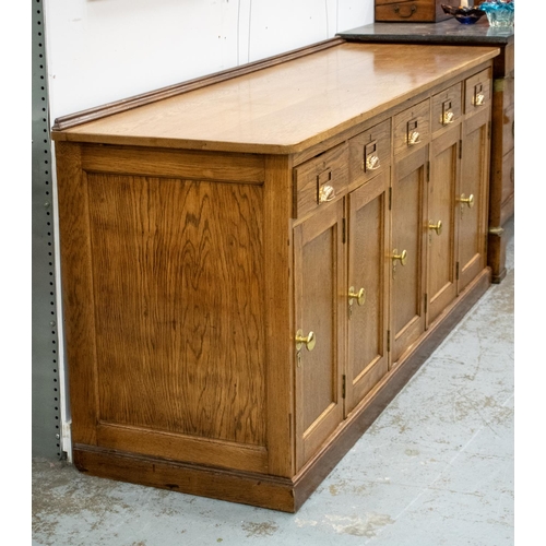 212A - SIDEBOARD, circa 1920, oak with five drawers above five doors, Provenance: Kings College, London, 88... 