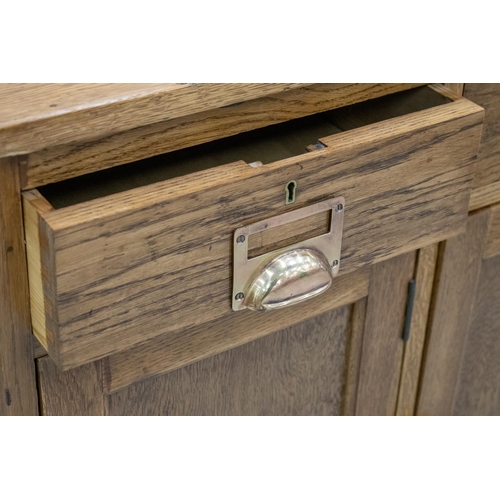 212A - SIDEBOARD, circa 1920, oak with five drawers above five doors, Provenance: Kings College, London, 88... 