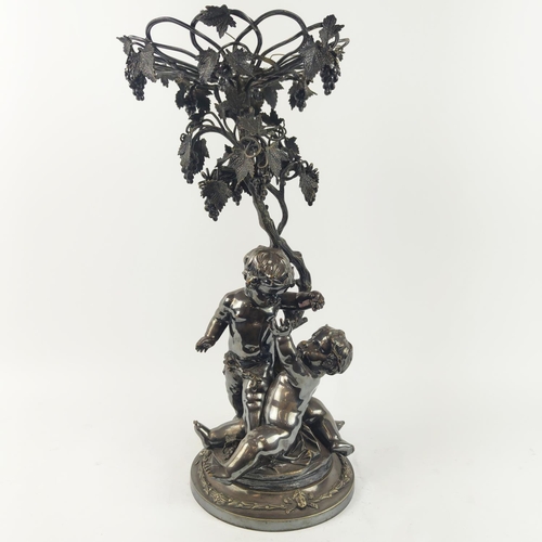 13 - A SILVER PLATED FIGURAL EPERGENE, in the form of cherubs, grapevine decoration, 46cm H.