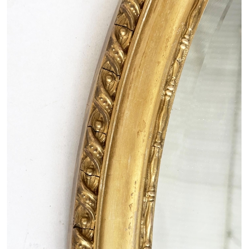 195 - WALL MIRROR, oval George III design giltwood and gesso moulded with bevelled mirror, 82cm x 60cm H.