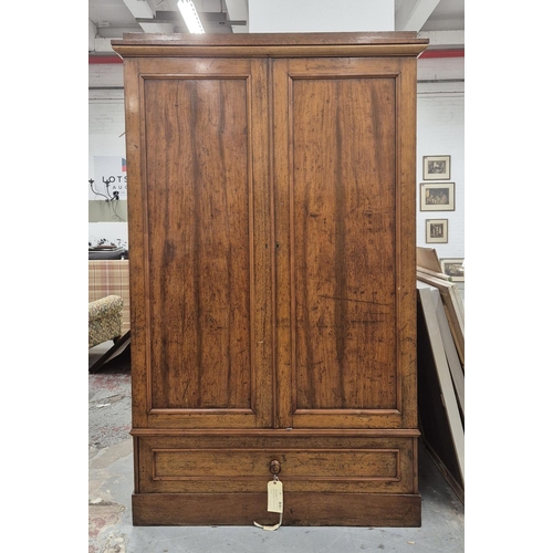 201 - REGENCY OAK AND HOLLY WARDROBE, with a pair of panelled doors enclosing hanging space over a drop fr... 