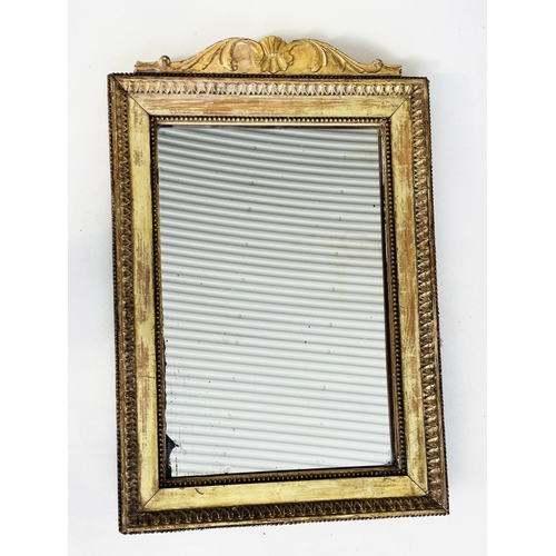 232 - WALL MIRROR, 19th century giltwood and gesso rectangular with beaded frame and scroll crest, 41cm W ... 