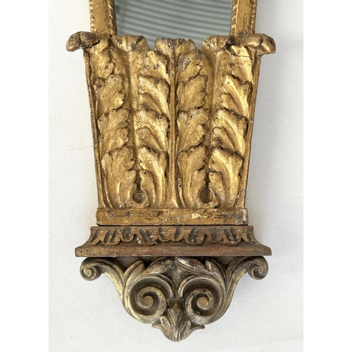 235 - WALL MIRROR, early 19th century Italian carved giltwood, trapezoid with crest, 88cm H x 33cm W.