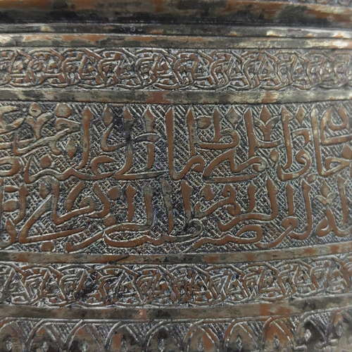 27 - A MAMLUK TINNED COPPER POURING VESSEL, spouted with engraved calligraphy inscription band, 40cm D x ... 