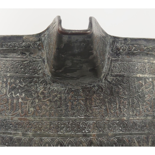 27 - A MAMLUK TINNED COPPER POURING VESSEL, spouted with engraved calligraphy inscription band, 40cm D x ... 