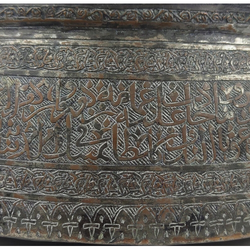 27 - A MAMLUK TINNED COPPER POURING VESSEL, spouted with engraved calligraphy inscription band, 40cm D x ... 