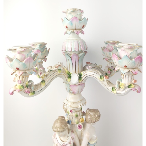 28 - CANDELABRAS, a pair, 19th century, Rococo style German porcelains with modelled ladies and under gla... 