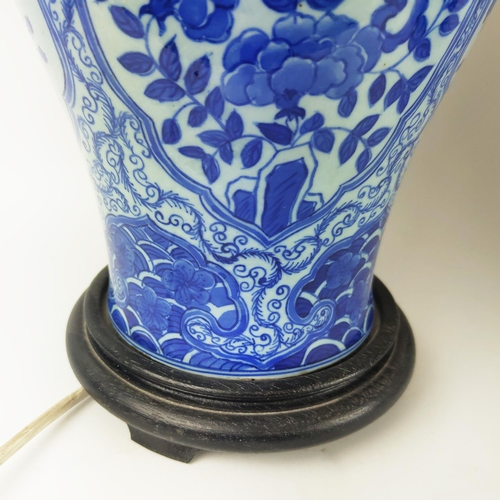 29 - CHINESE LAMPS, a pair, with blue and white peony decoration and pleated silk shades and another pair... 