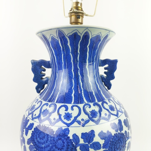 29 - CHINESE LAMPS, a pair, with blue and white peony decoration and pleated silk shades and another pair... 