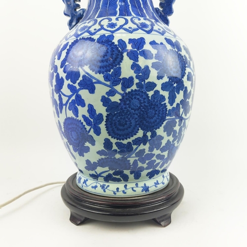 29 - CHINESE LAMPS, a pair, with blue and white peony decoration and pleated silk shades and another pair... 