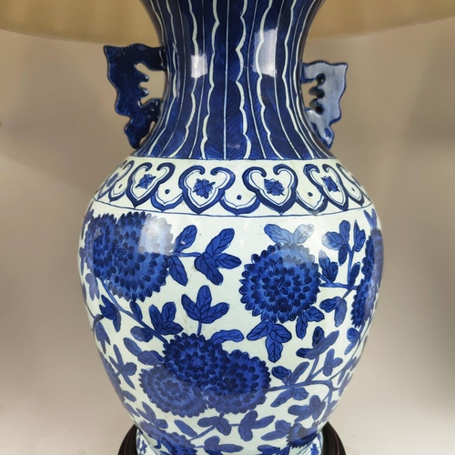 29 - CHINESE LAMPS, a pair, with blue and white peony decoration and pleated silk shades and another pair... 