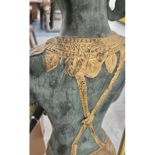 291 - A THAI FIGURAL FLOOR LAMP, verdigris and gilt metal with shade, 165cm H.