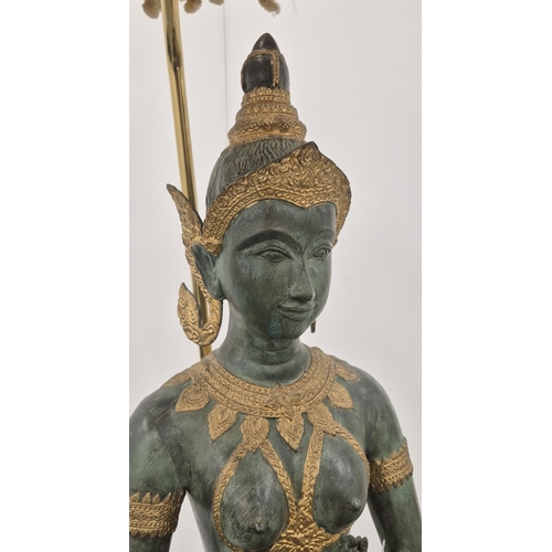 291 - A THAI FIGURAL FLOOR LAMP, verdigris and gilt metal with shade, 165cm H.