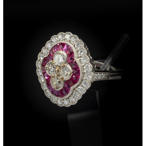 30C - PLATINUM VICTORIAN STYLE RUBY AND DIAMOND QUATREFOIL RING, set with round brilliant cut diamonds and... 