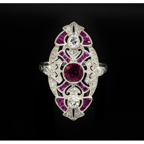 30D - PLATINUM EDWARDIAN-STYLE RUBY AND DIAMOND DRESS RING, with a beaded finish. Central round-cut ruby 0... 