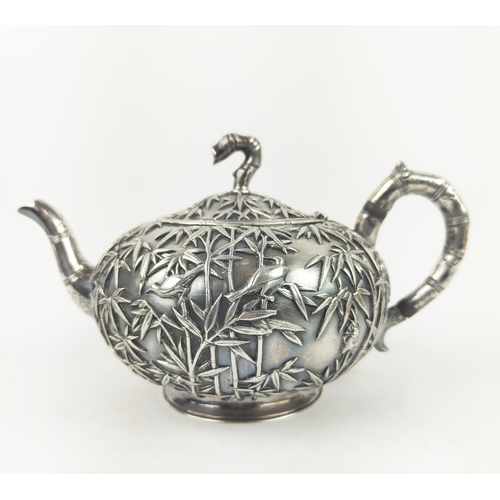 31 - CHINESE EXPORT SILVER THREE PIECE TEASET, by Wang Hing, comprising teapot, sugar bowl and milk jug, ... 