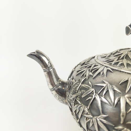 31 - CHINESE EXPORT SILVER THREE PIECE TEASET, by Wang Hing, comprising teapot, sugar bowl and milk jug, ... 