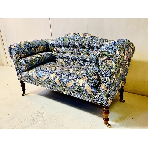 402 - SOFA, Victorian style, with buttoned back, William Morris style upholstery on turned wooden supports... 