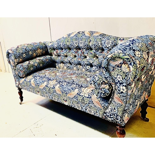 402 - SOFA, Victorian style, with buttoned back, William Morris style upholstery on turned wooden supports... 