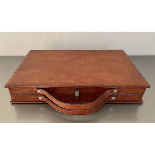 406 - TRAVELLING BACKGAMMON SET, tan leathered case, 23cm W x 40cm D x 7cm H.