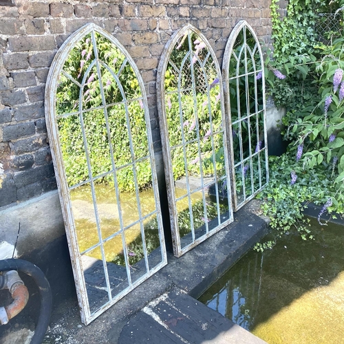 416 - GARDEN WALL MIRRORS, a set of three, metal arched frames, 160cm H x 67cm W. (3)