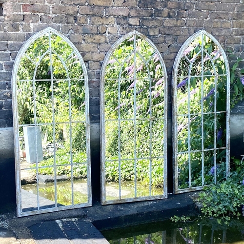 416 - GARDEN WALL MIRRORS, a set of three, metal arched frames, 160cm H x 67cm W. (3)