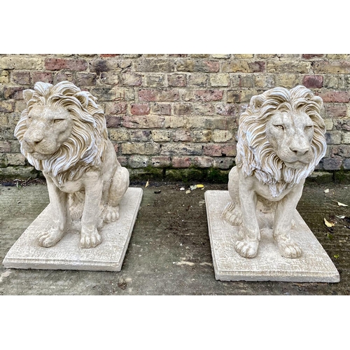 417 - SCULPTURAL GARDEN LIONS, a pair, composite stone, 70cm H x 42cm W x 72cm D. (2)